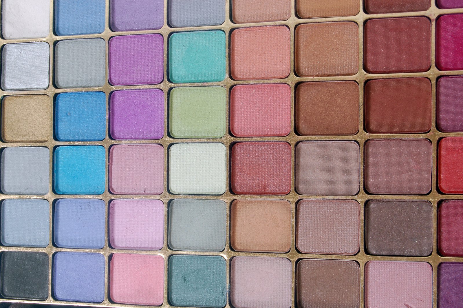 a close up of a colorful palette on a white background