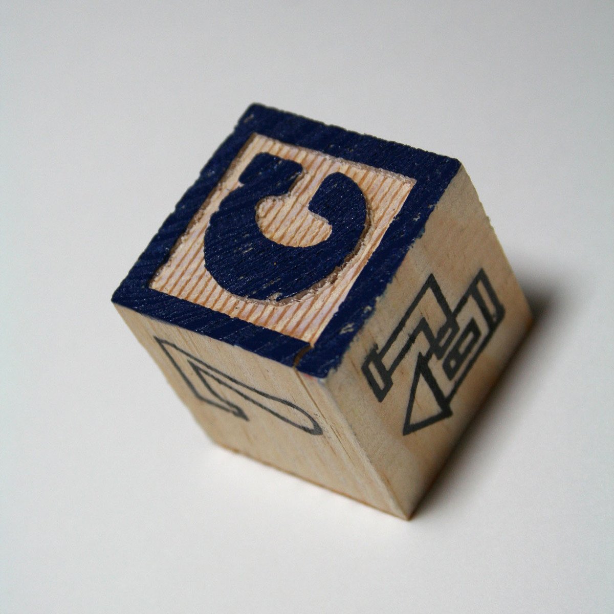 a rubber dice that has an abstract design on it
