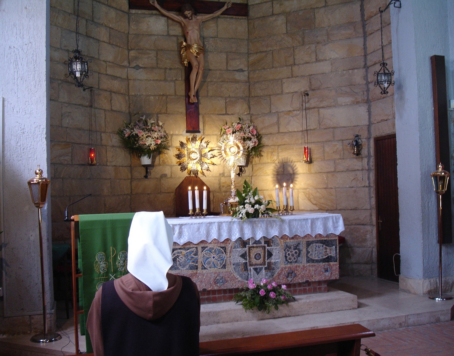 a woman is kneeling down at a church