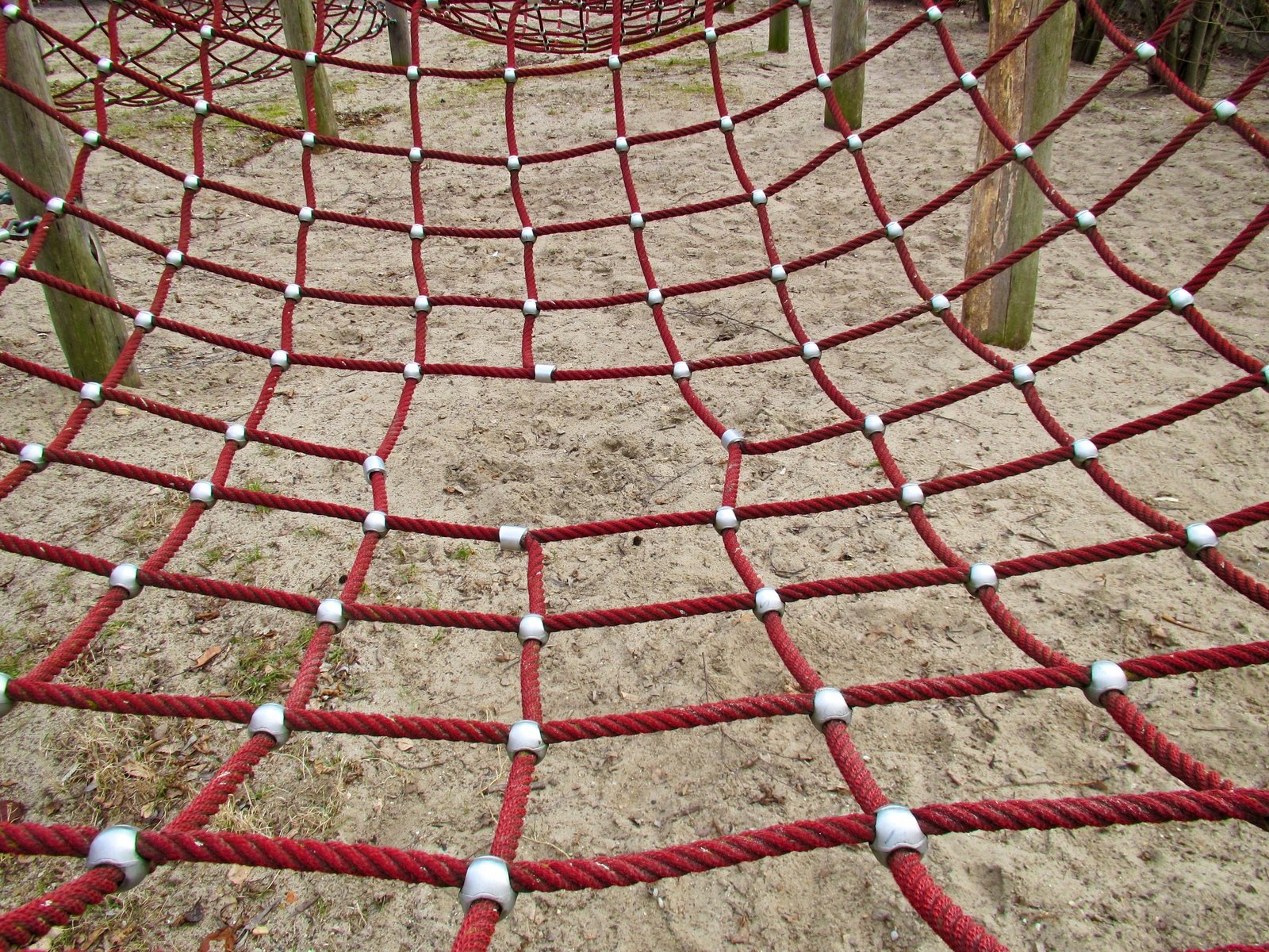 a very cute big rope net on a sandy ground