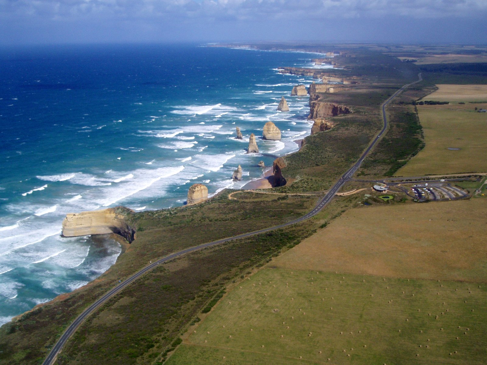 the coastline road is an aerial view near a town