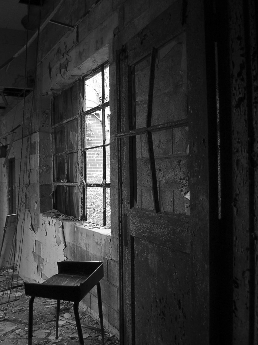black and white image of an abandoned building