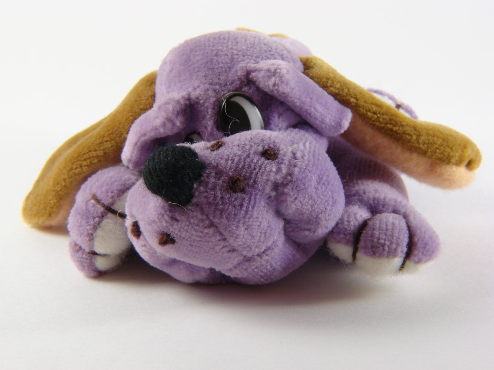 small plush toy with the nose sticking out