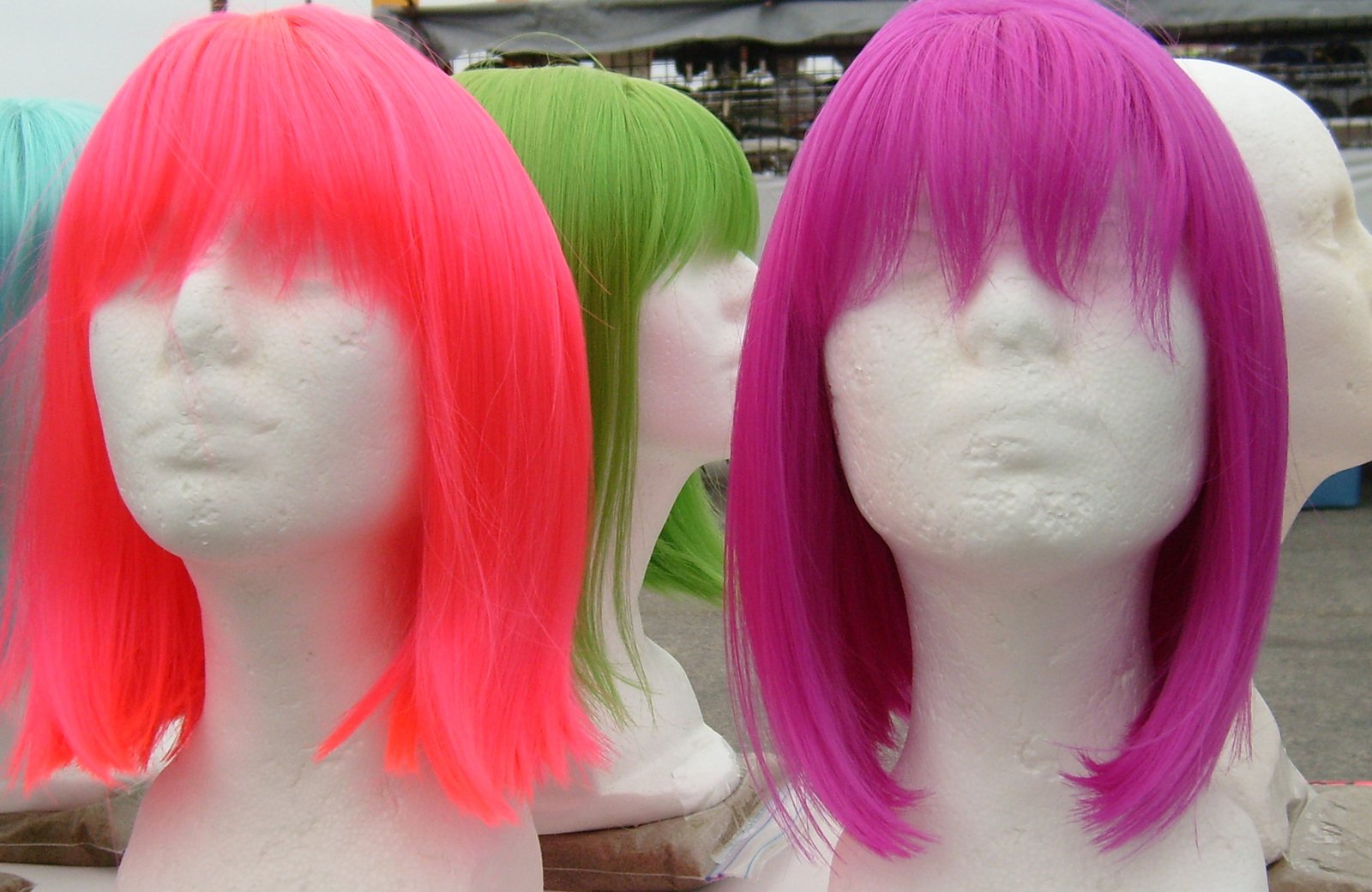 several wigs lined up to look like each other