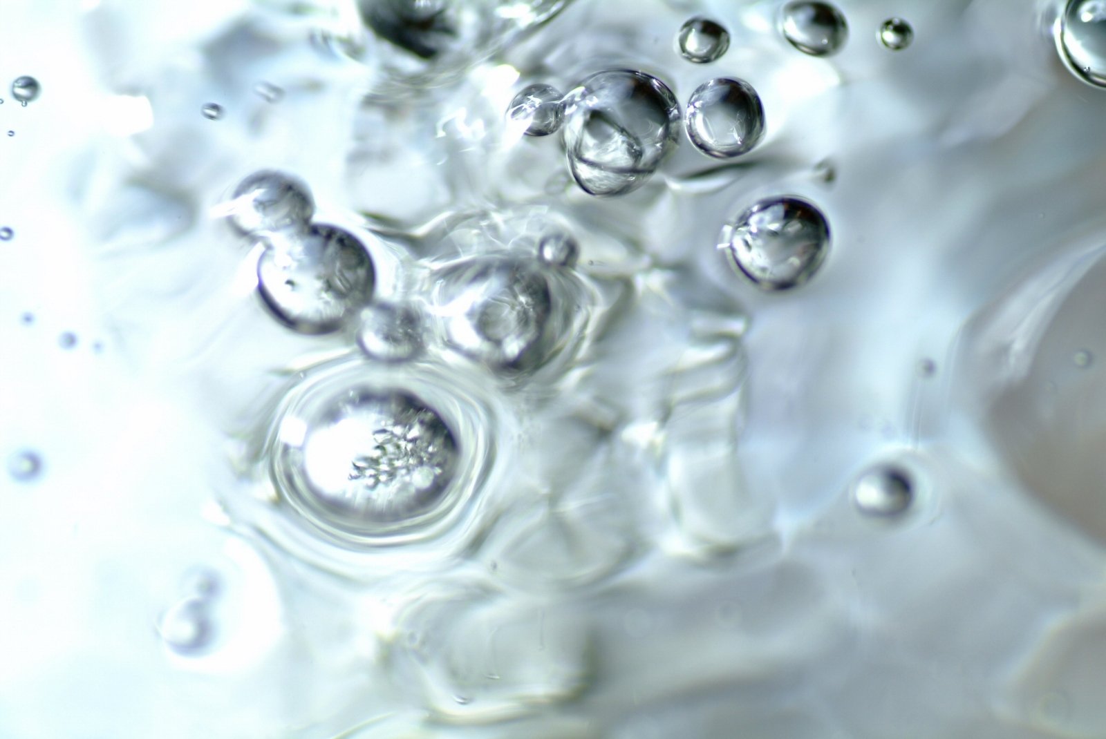 bubbles of water floating on a white surface