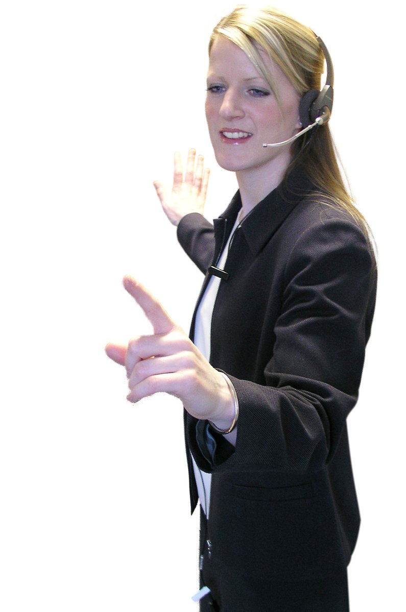 woman in black jacket giving the sign with her hands