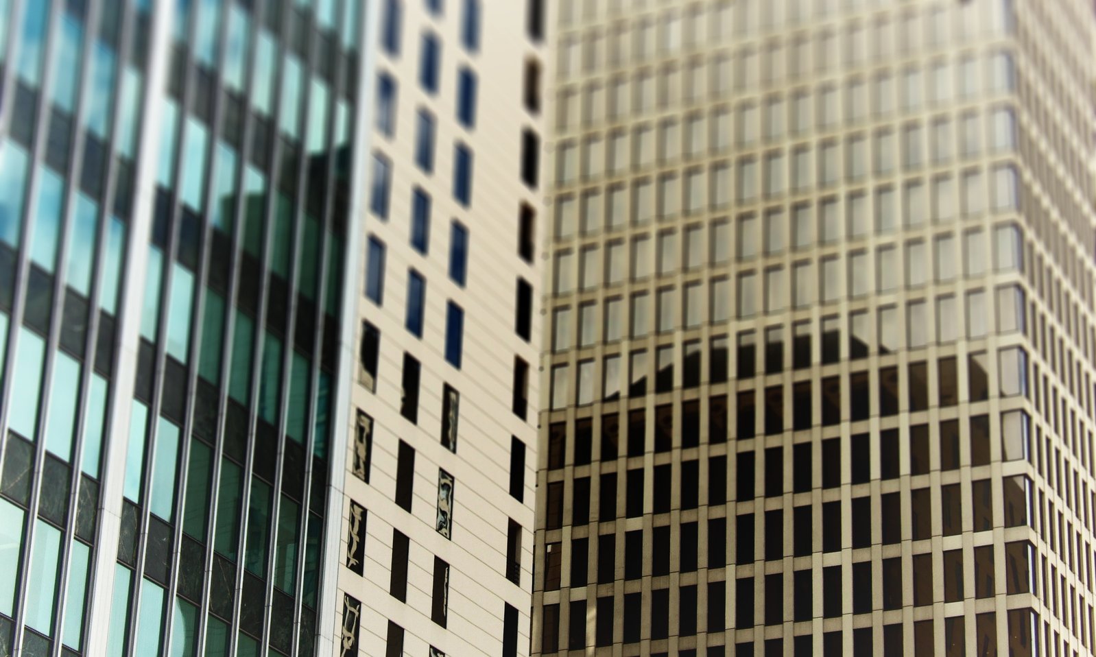two abstract pographs of buildings in one po