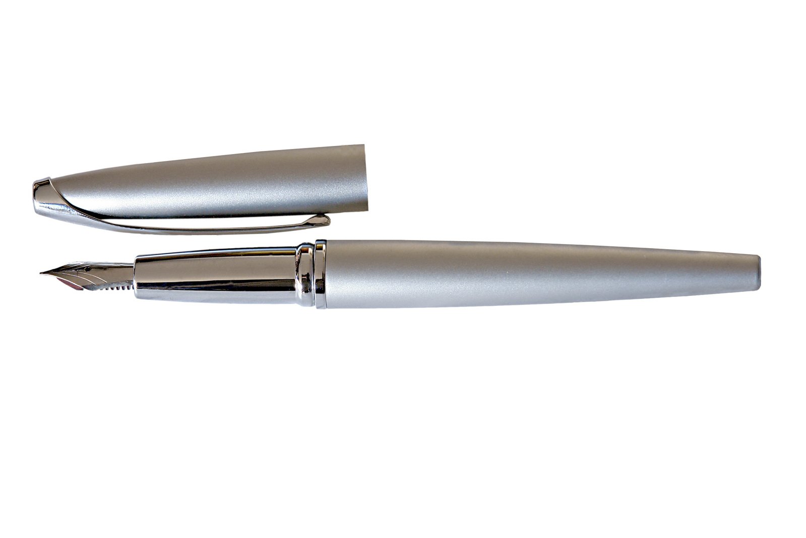 a pair of shiny silver pens laying next to each other