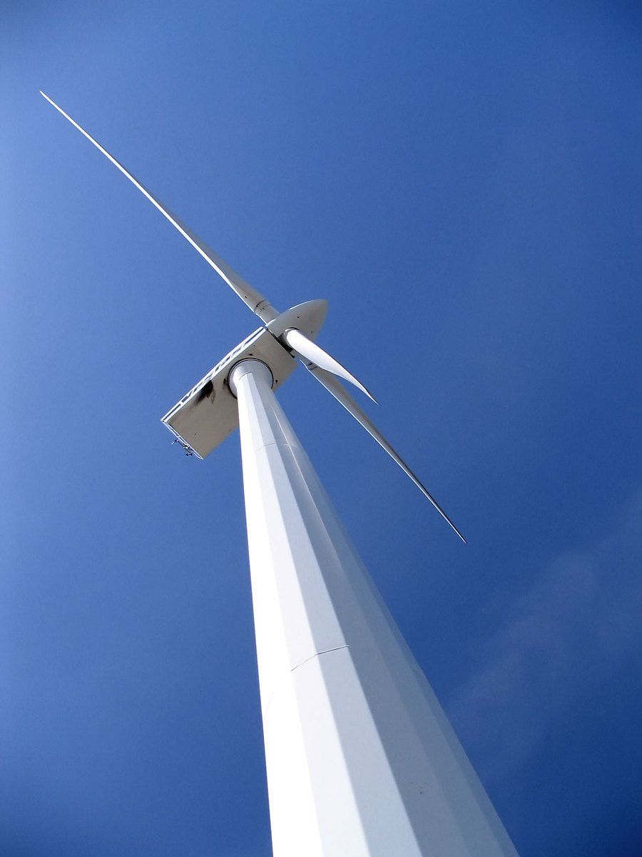 a wind turbine is white with two blades extending