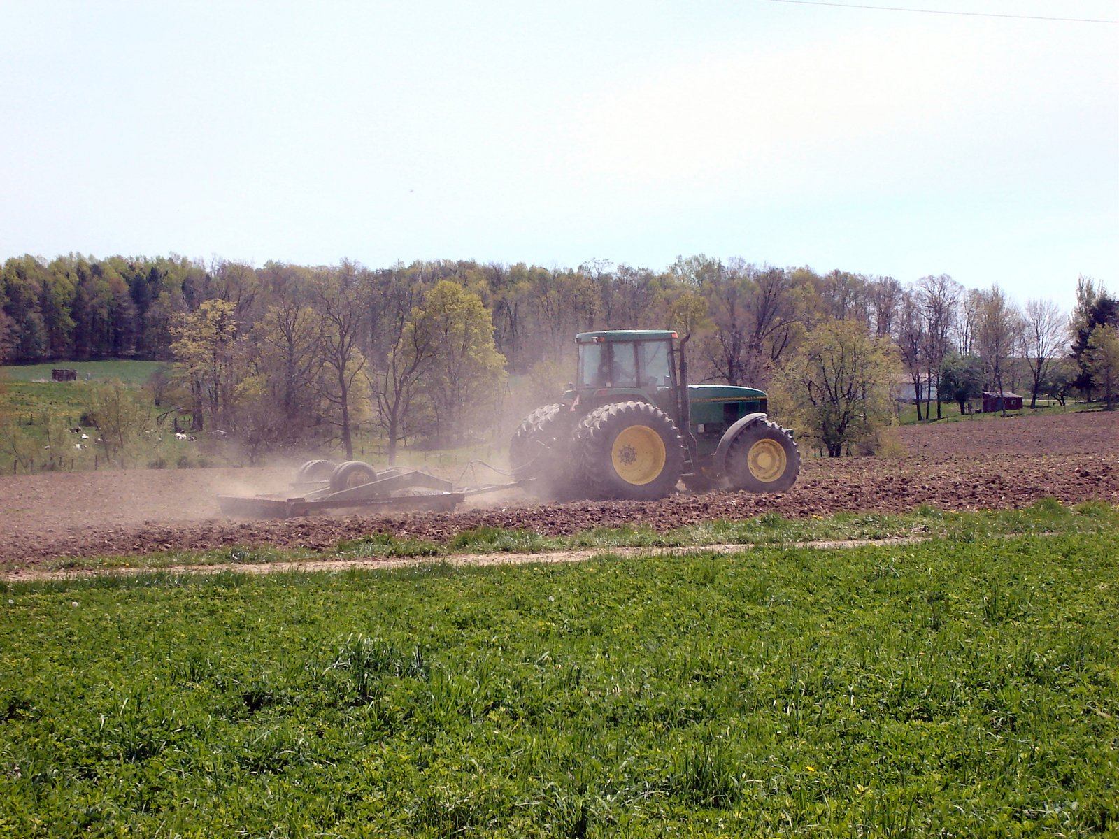 a tractor sowing crops on the farm