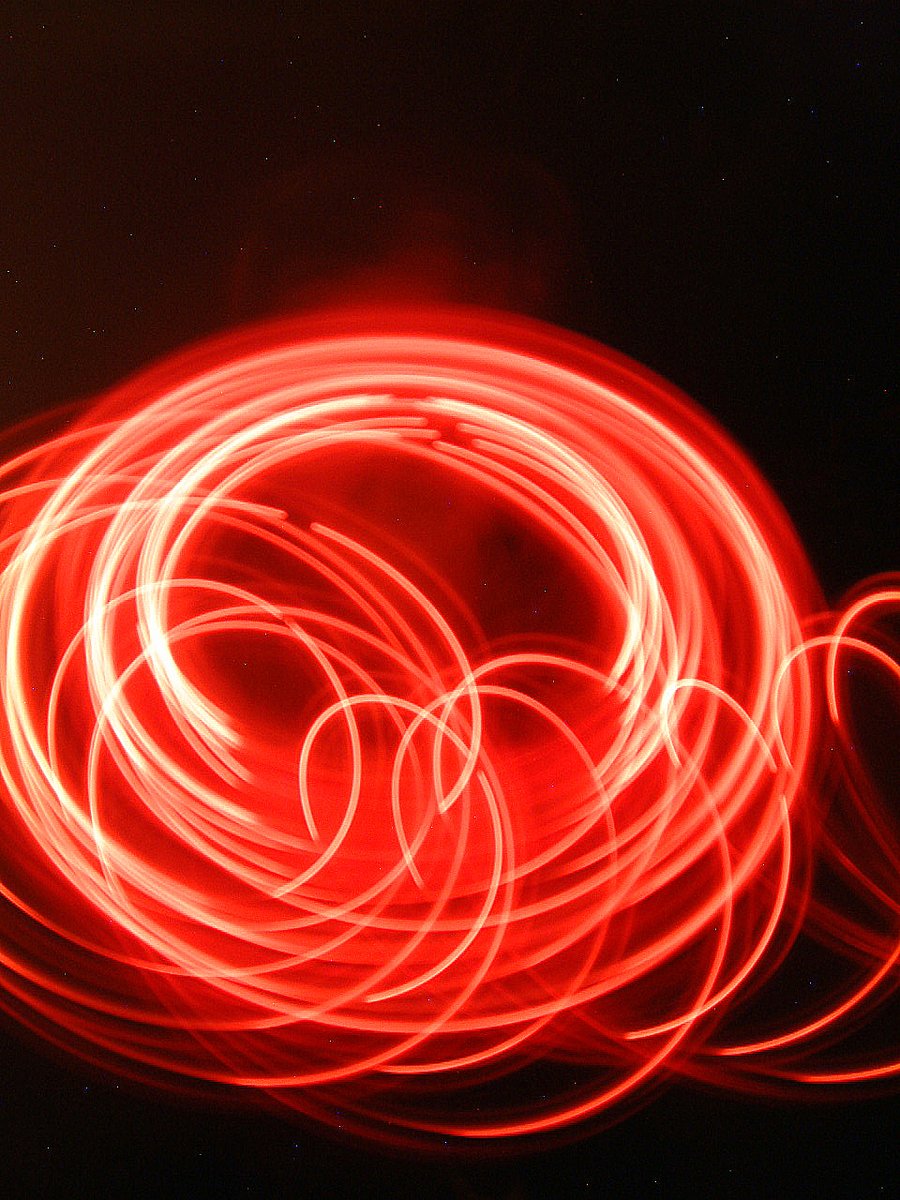 a red light painting on the wall and the floor
