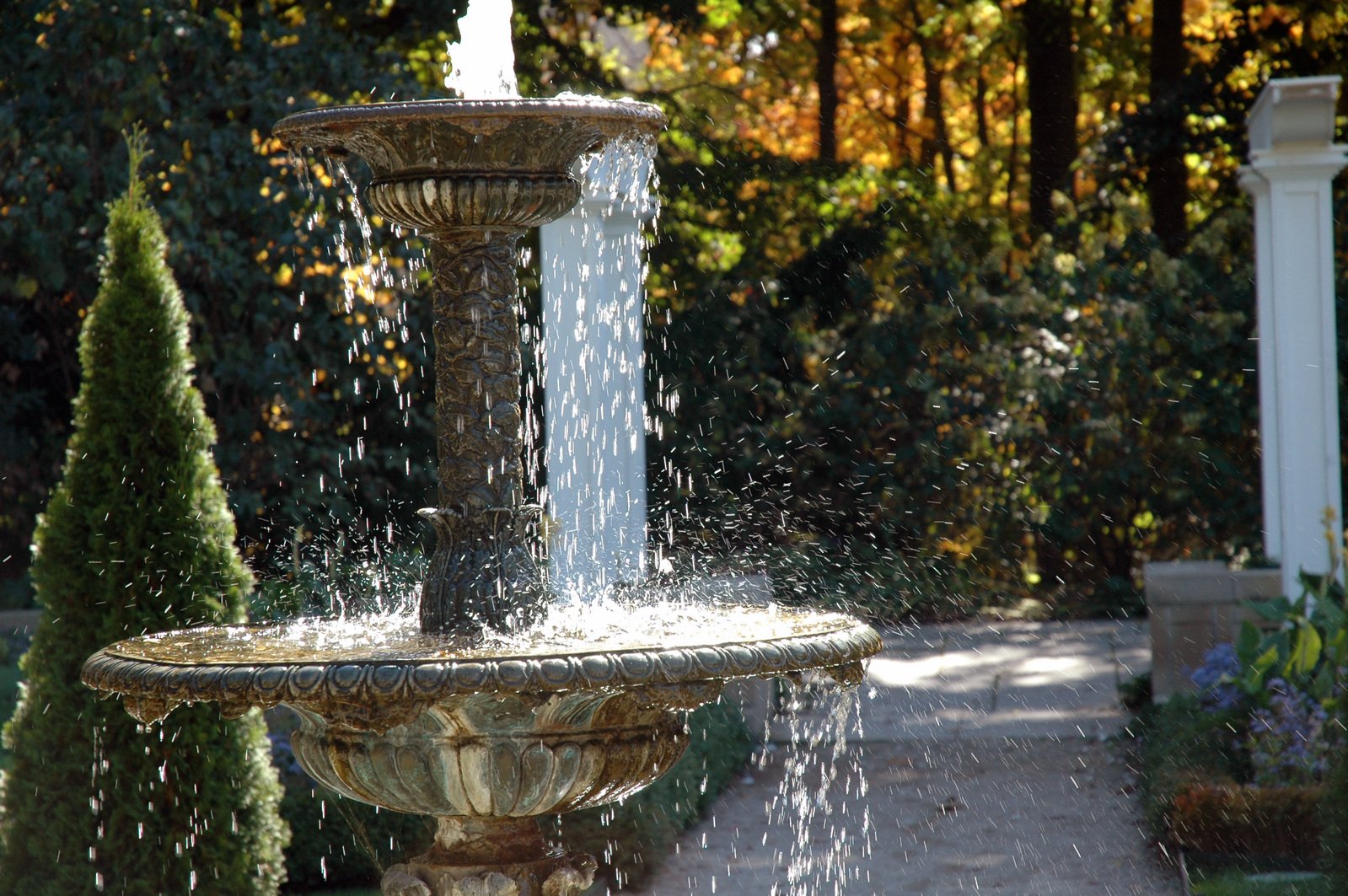 water pouring from the top of a fountain