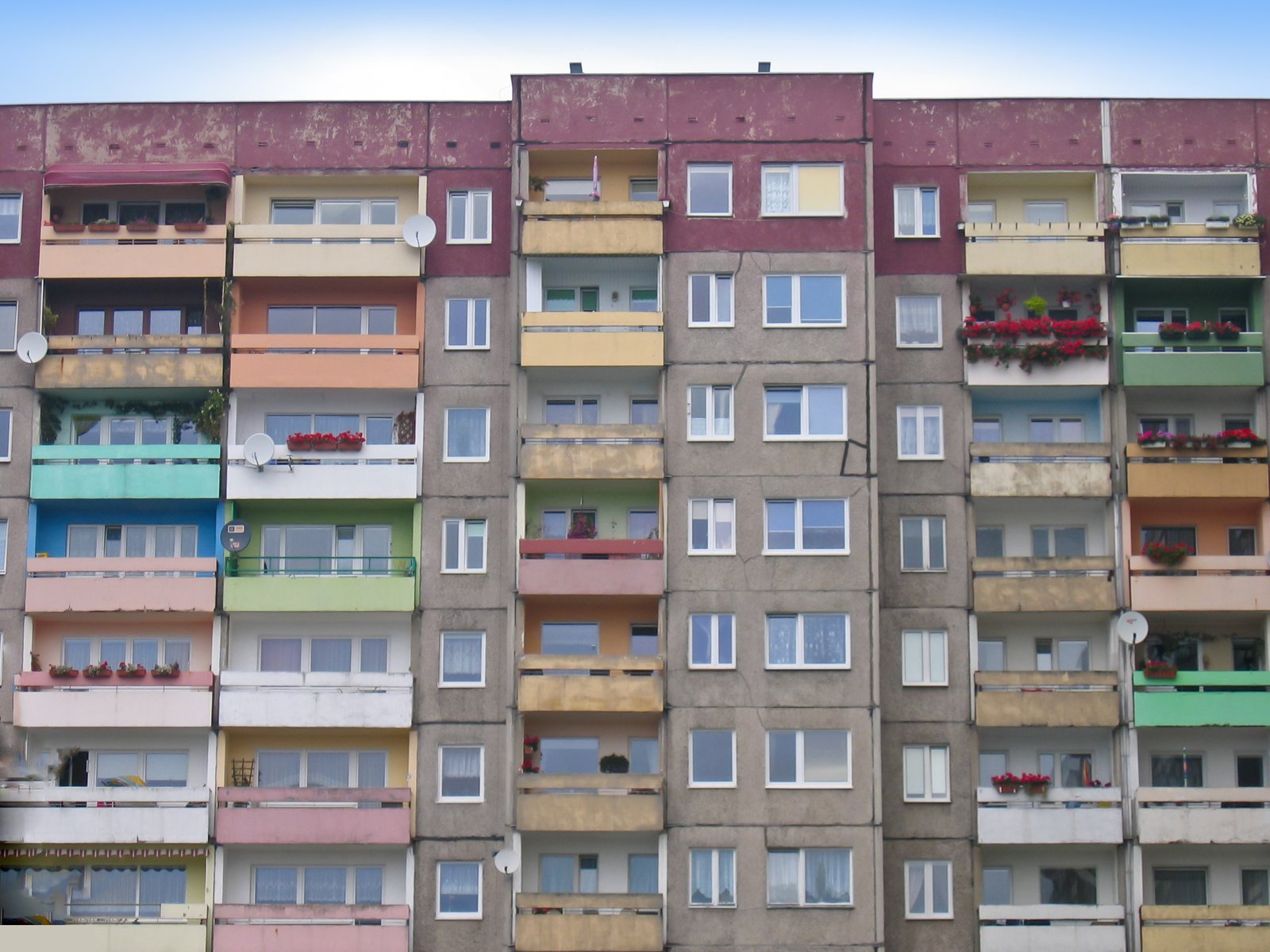 this tall building has lots of balconies on it