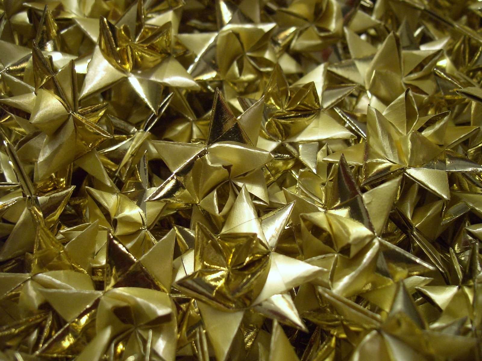 large collection of shiny gold metallic star