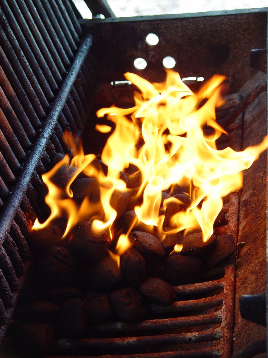  coal is being grilled over the fire