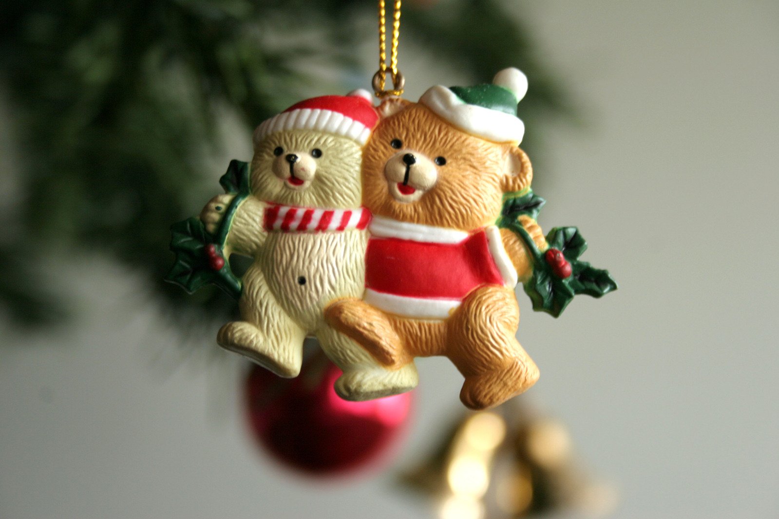 two teddy bears wearing christmas outfits ornament ornament