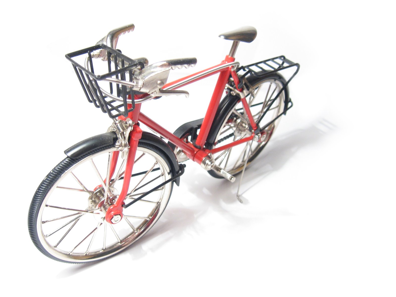 a red bicycle with two front baskets on it