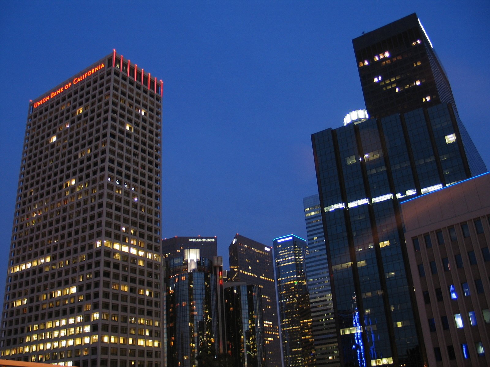the skyscrs are lit up in different colors and designs