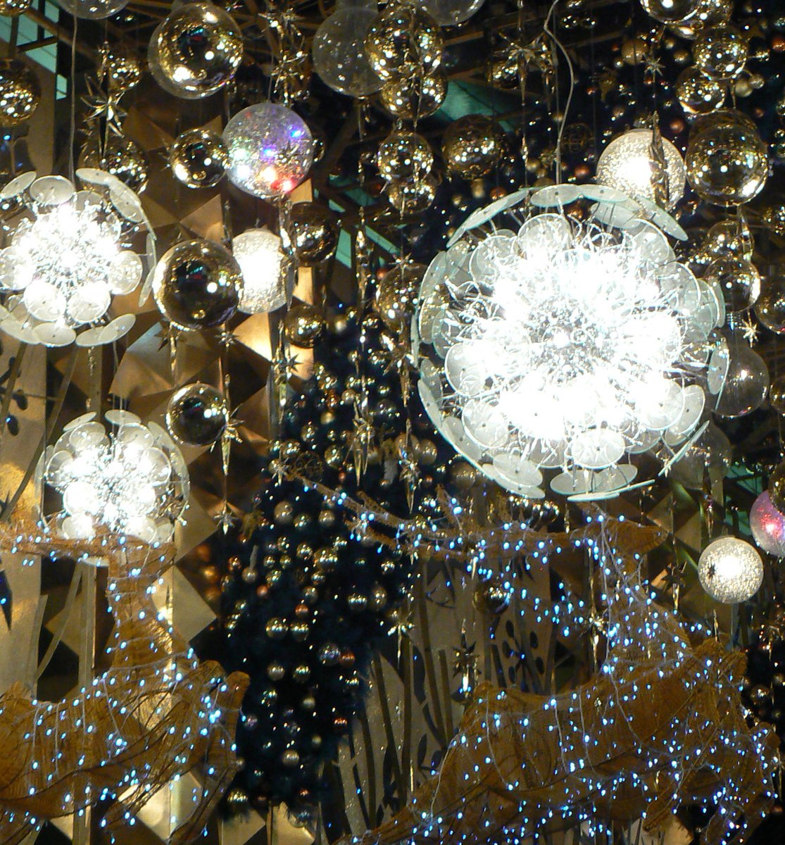 a bunch of fancy balls are attached to wires and a chandelier