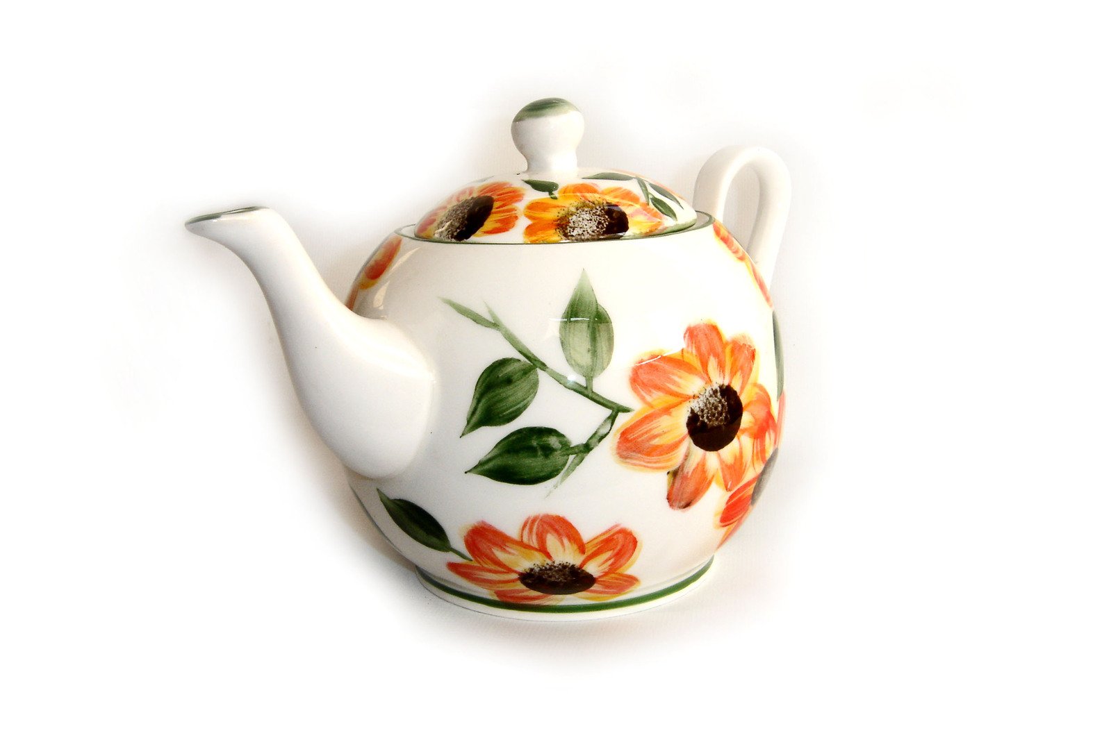 a coffee pot with flower designs on it