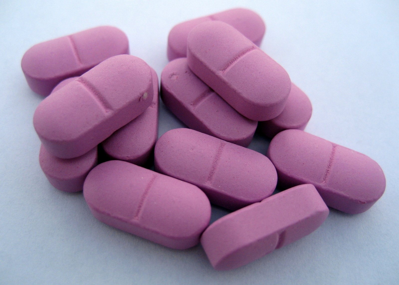 pink pills are shown in this closeup s