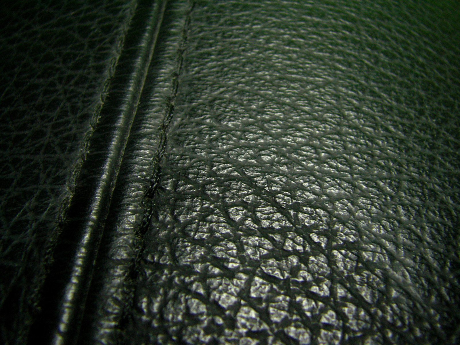 a black leather texture showing all over the surface