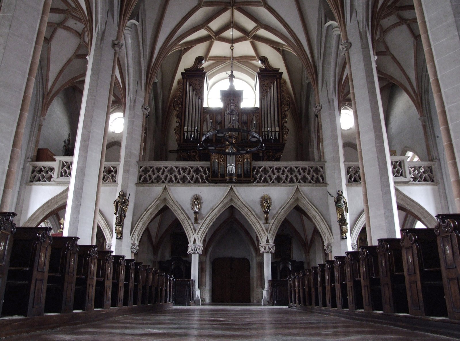 the inside of a church with high ceilings and wood