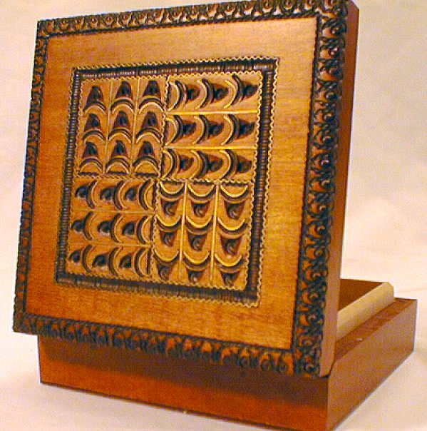 a wooden object with an elaborate design on it