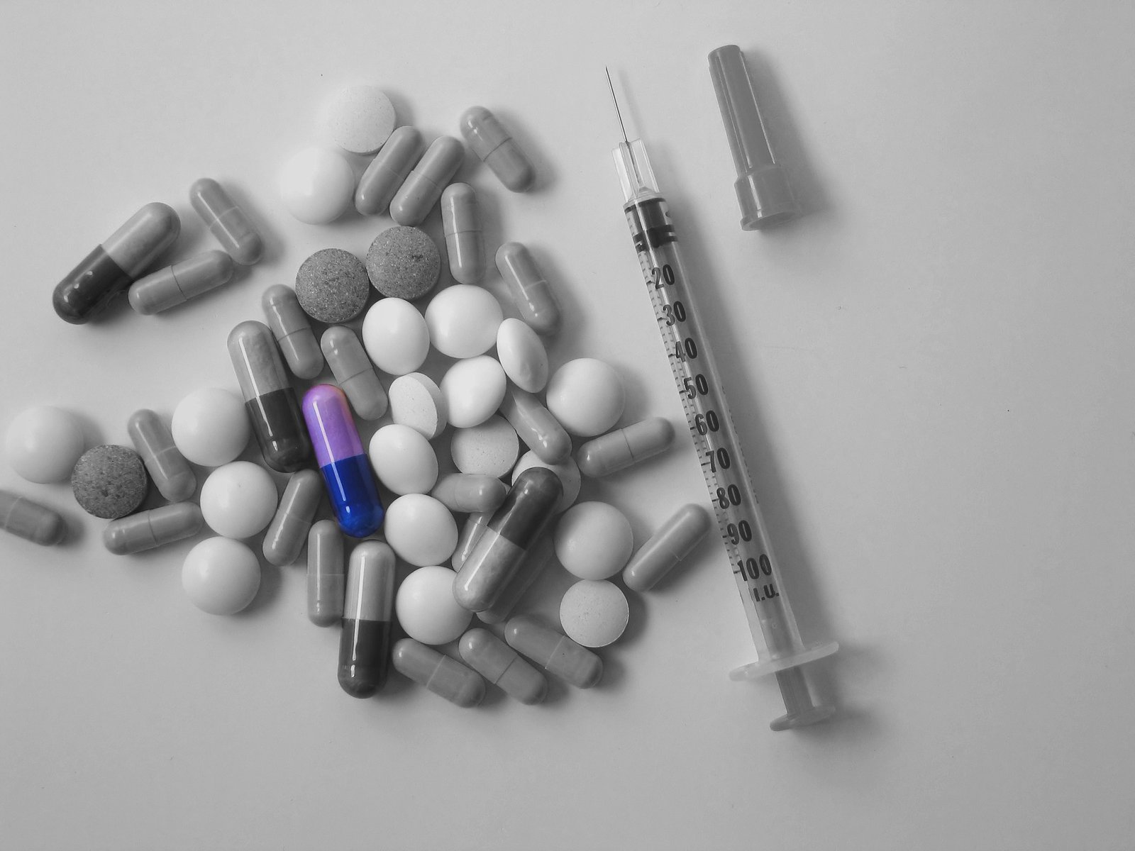 assortment of medical supplies placed on white table