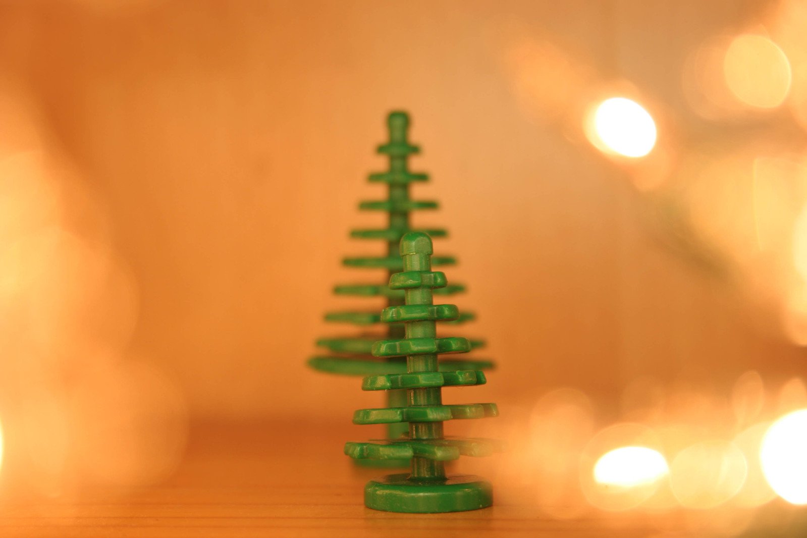 a plastic green christmas tree with white stars