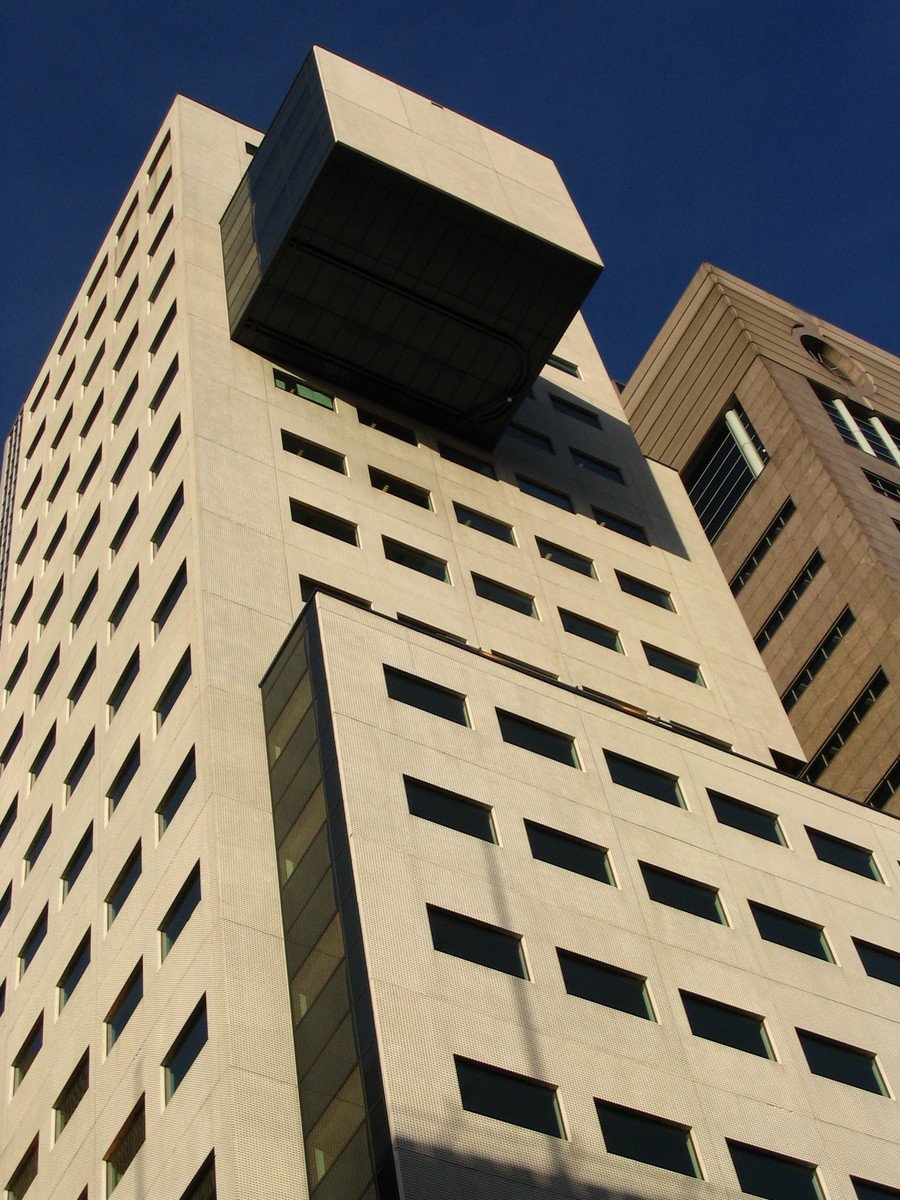 a tall building with windows that look like a box in the sky