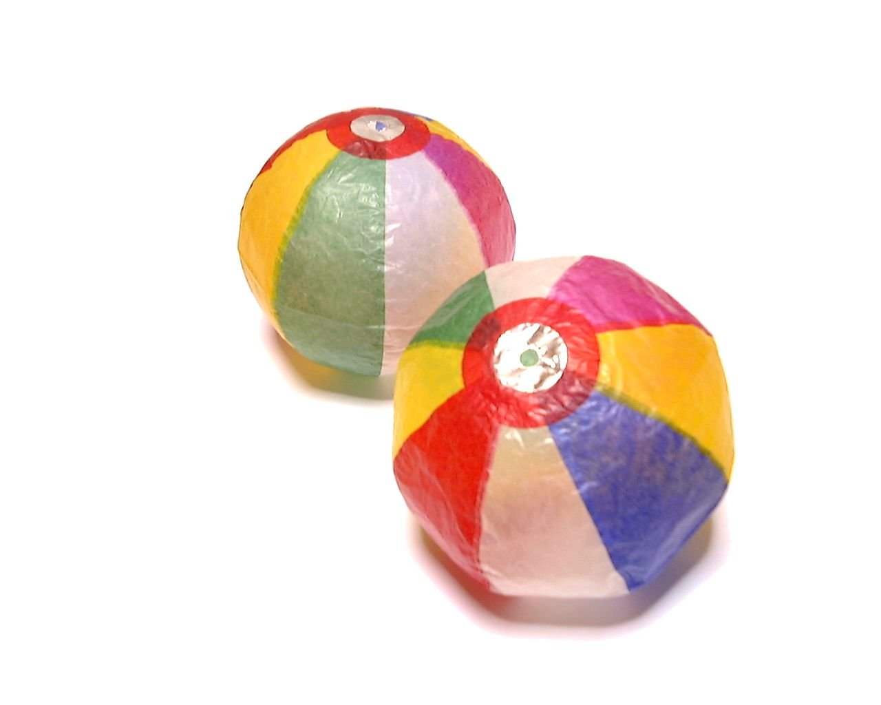two plastic balls with red, yellow, blue, green and pink designs
