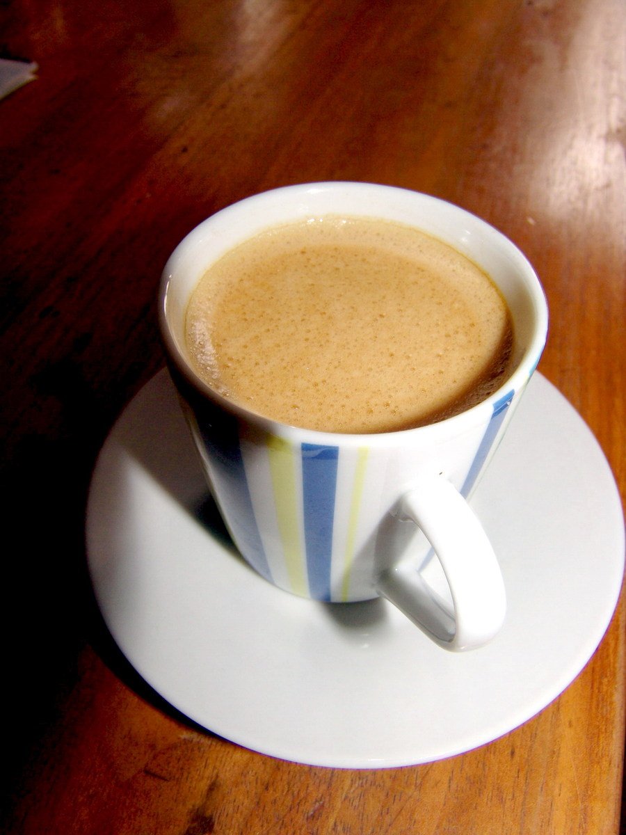 a cup of coffee that is on top of a saucer