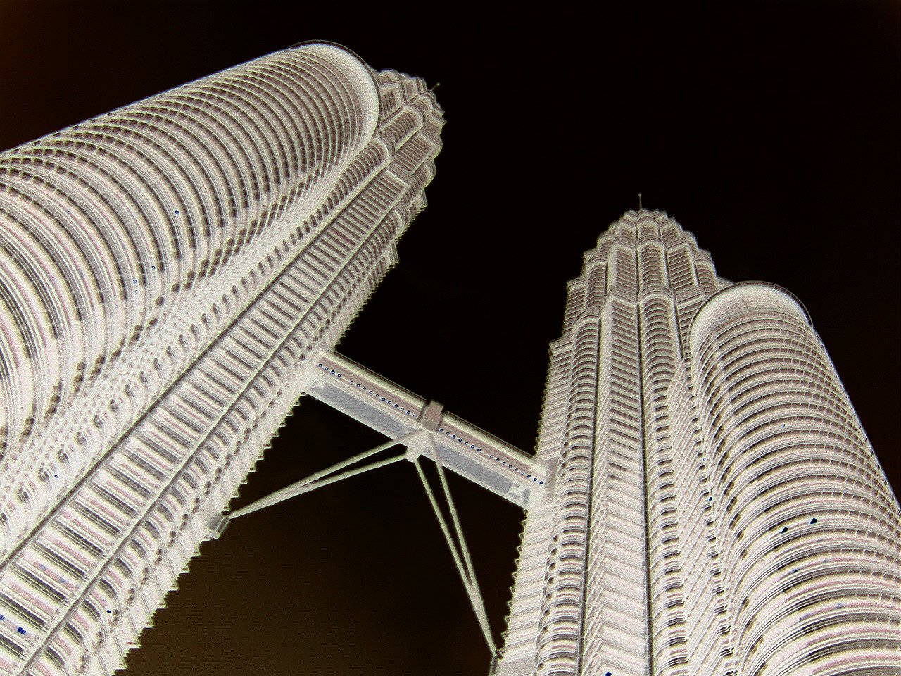 two tall towers that are standing in the air