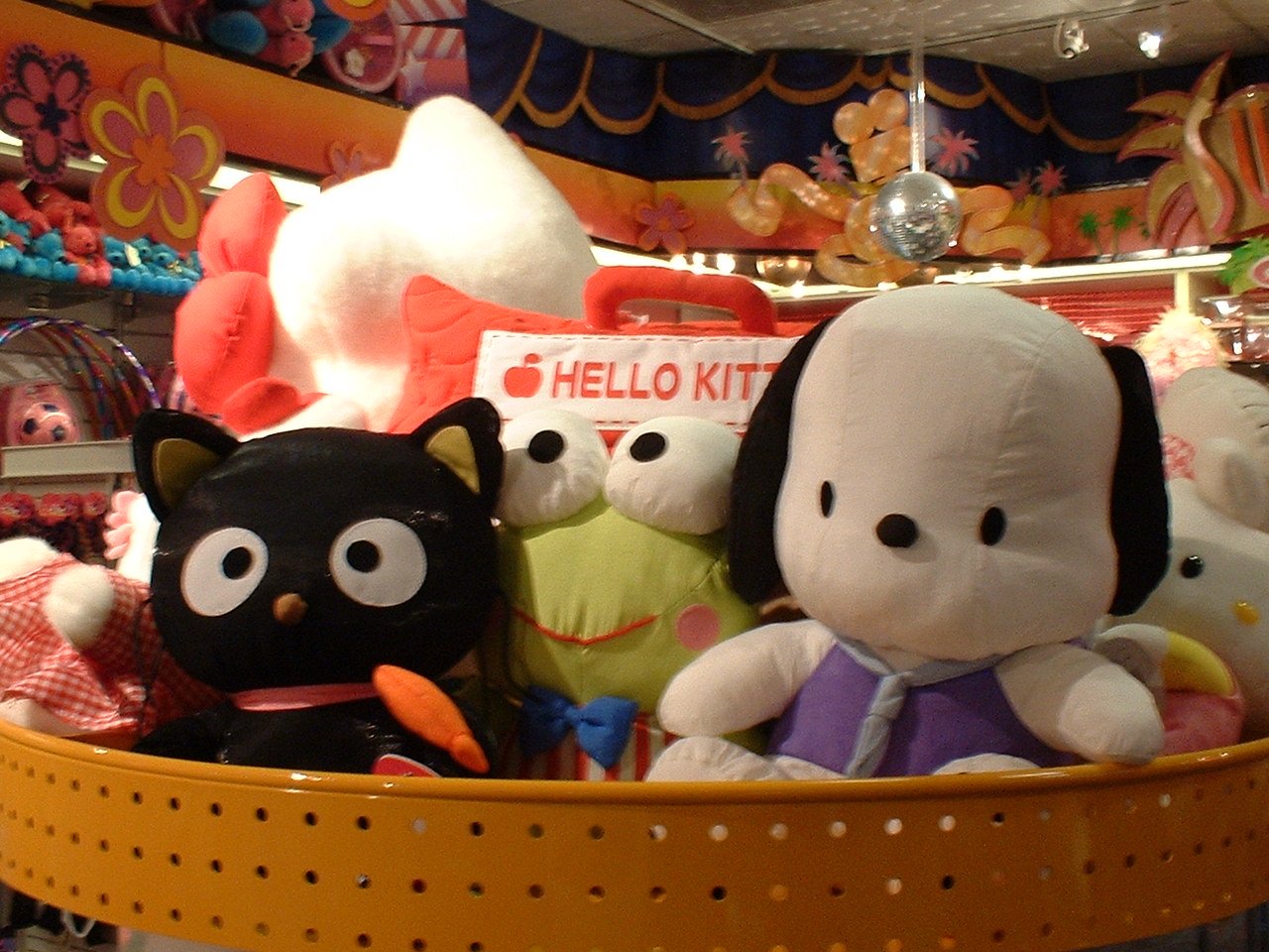 various stuffed animals are on display in a store