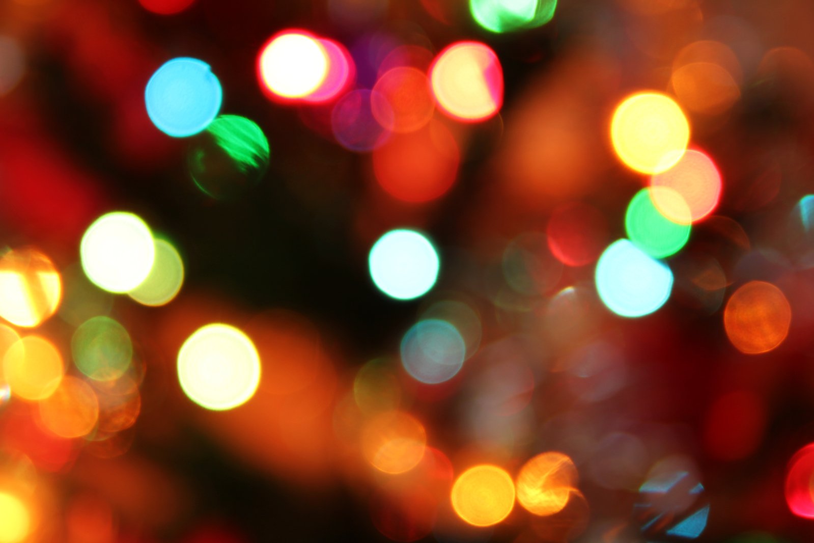 a brightly colored christmas tree is shown in this image