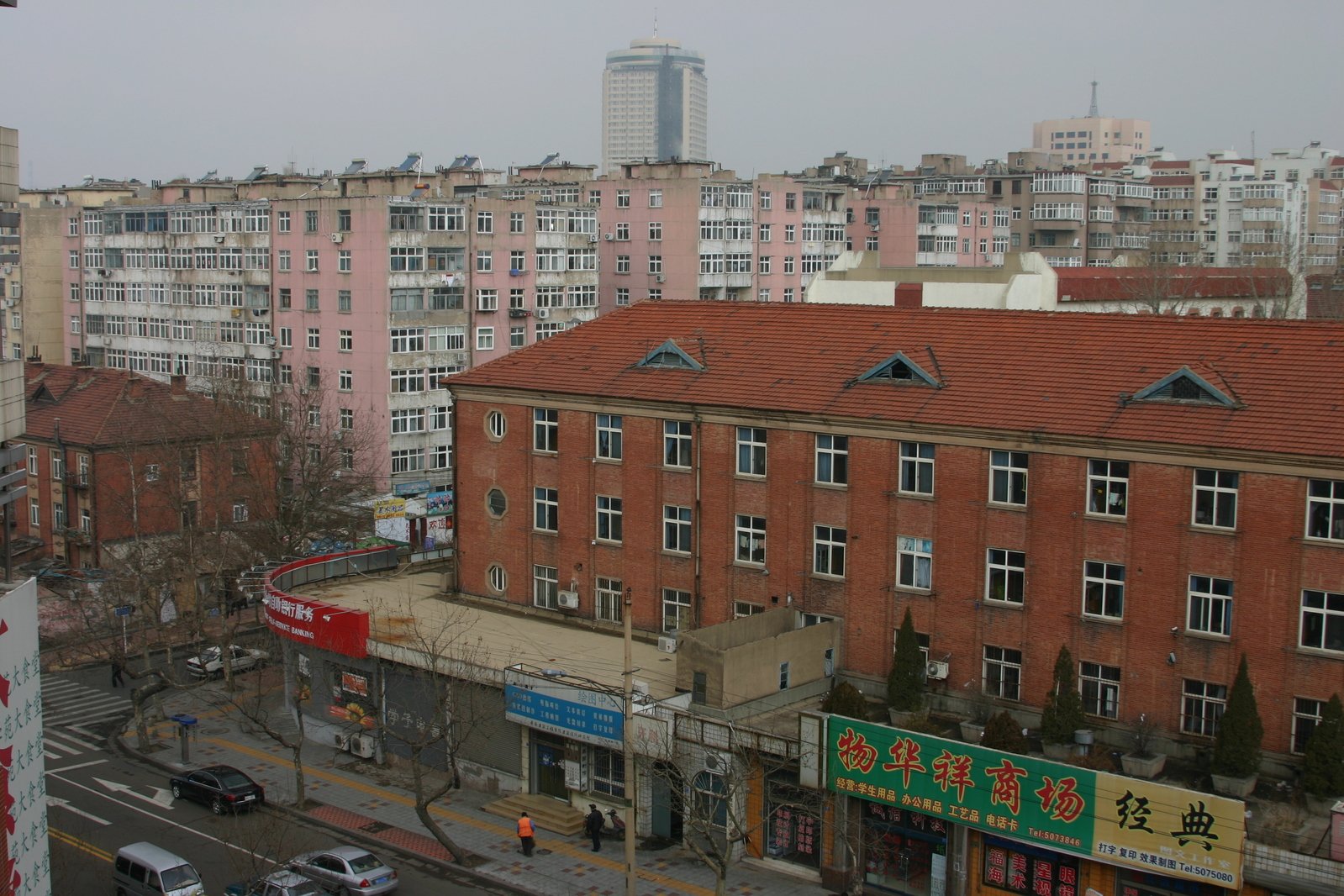 a view from a building with several buildings in the background