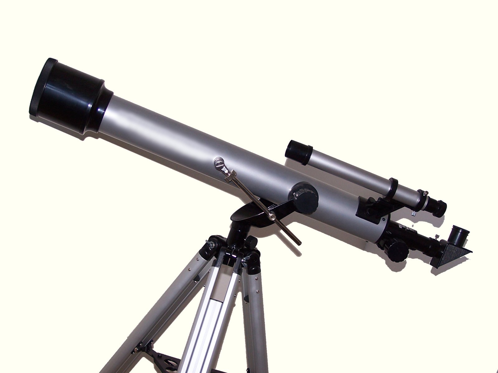 a telescope and tripod on a white background