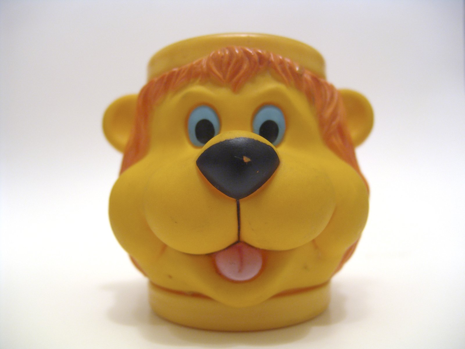 a toy figurine depicting the face of a dog