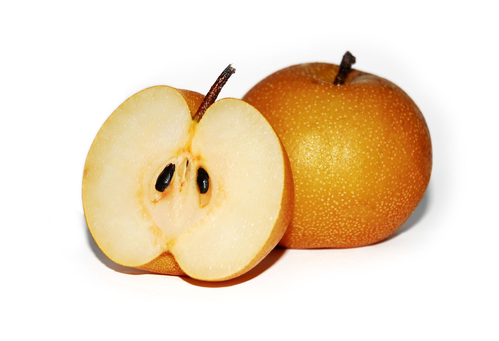 two apples that are cut in half, with one apple inside