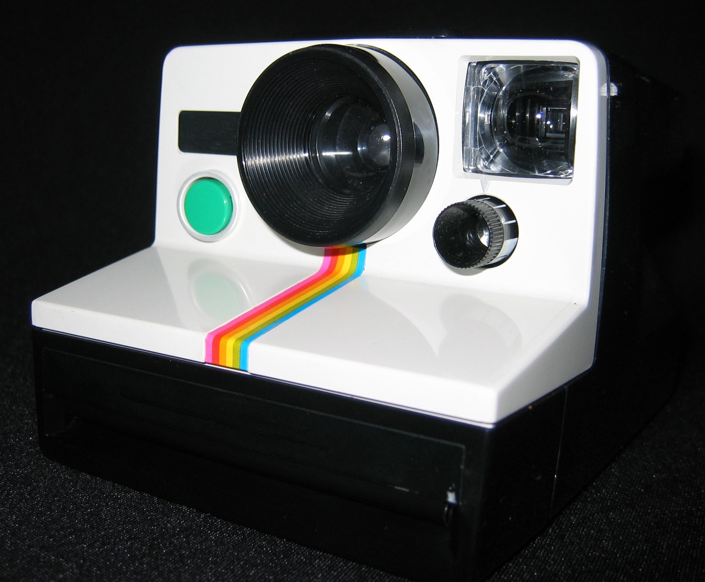 an image of an old polaroid camera on a stand