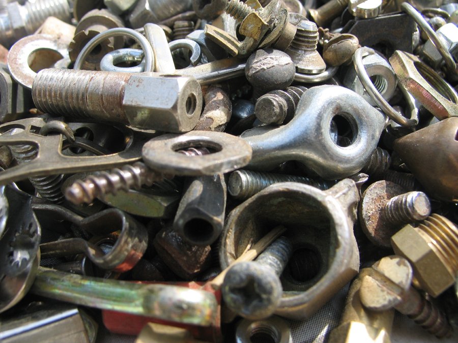 a pile of screws, nuts and bolts