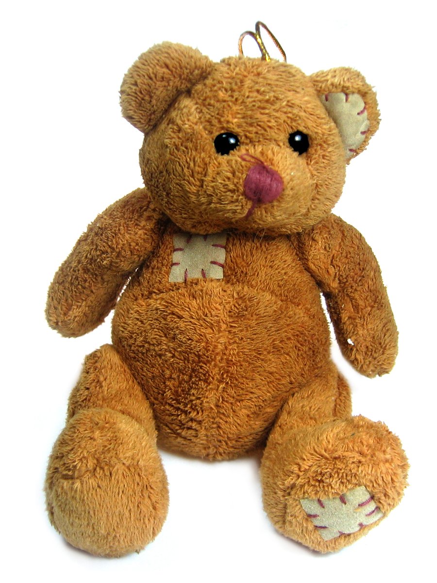 the teddy bear with the letters o and m is tan