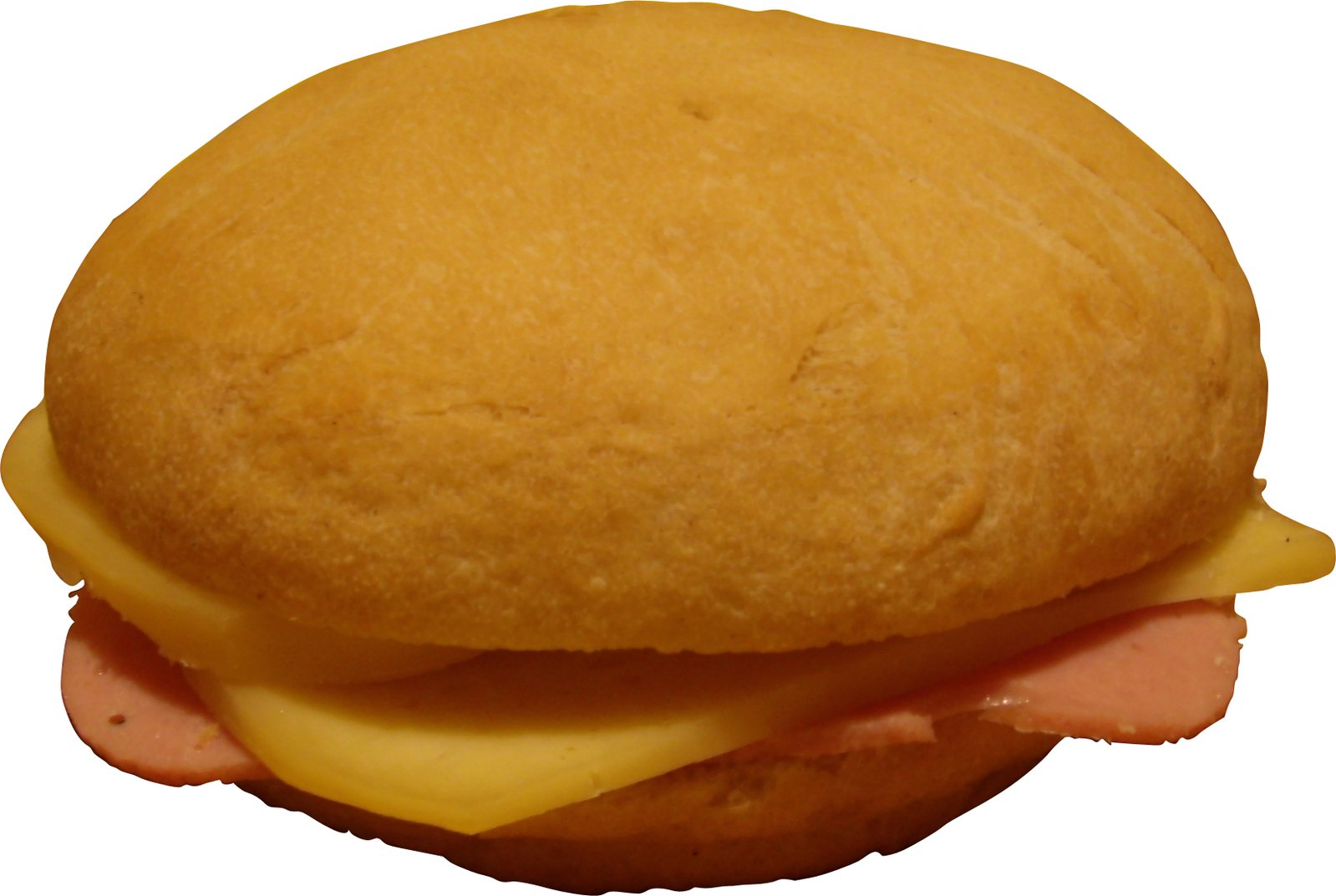 a ham and cheese sandwich sitting on top of a roll