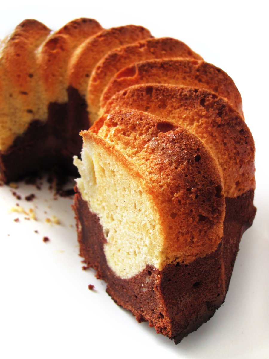 a white cake with chocolate and white frosting