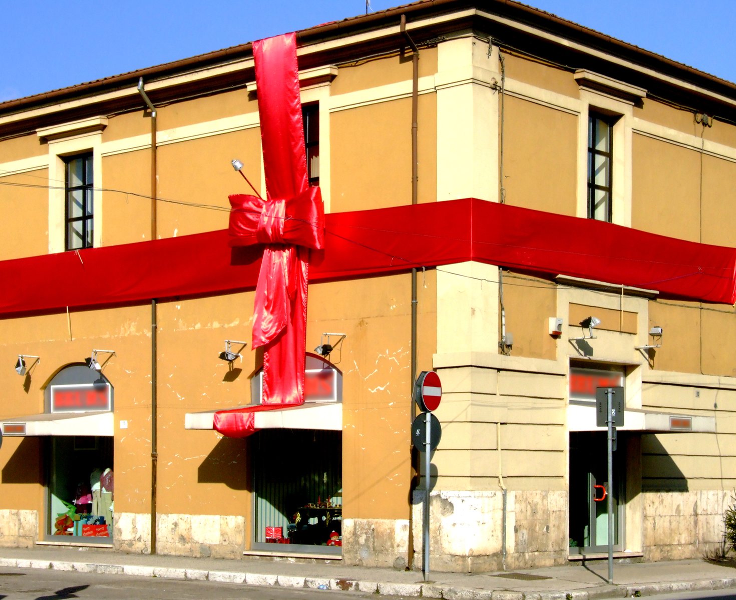 an image of a red bow on the side of a building