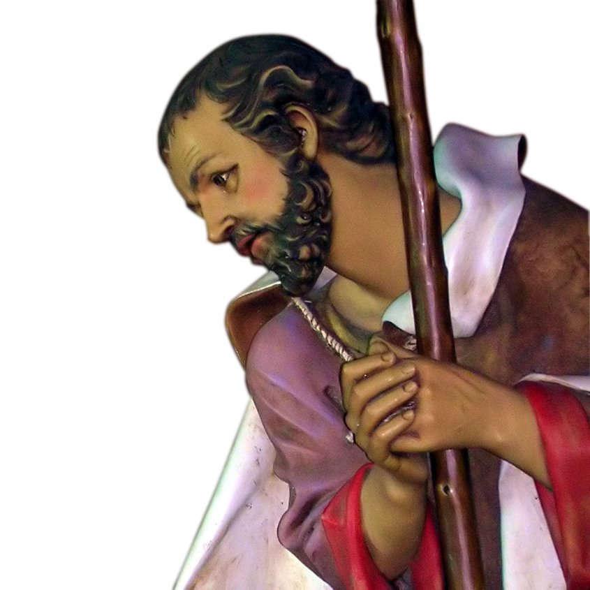 jesus carrying the cross statue on a white background