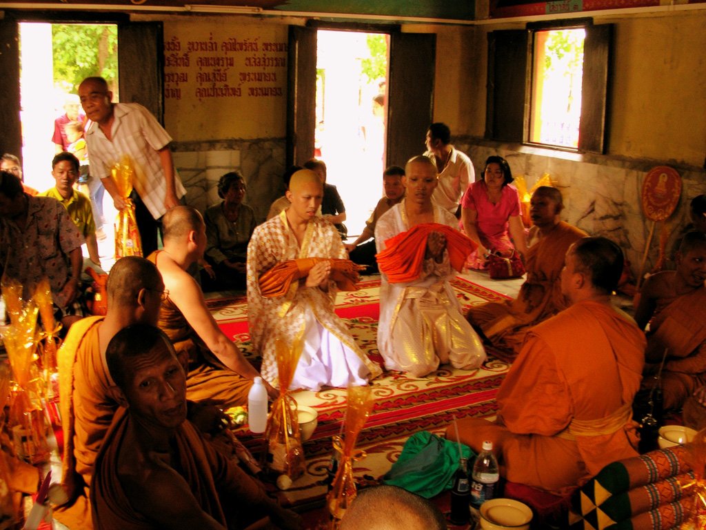 buddhist people and their offerings are presented for the monks