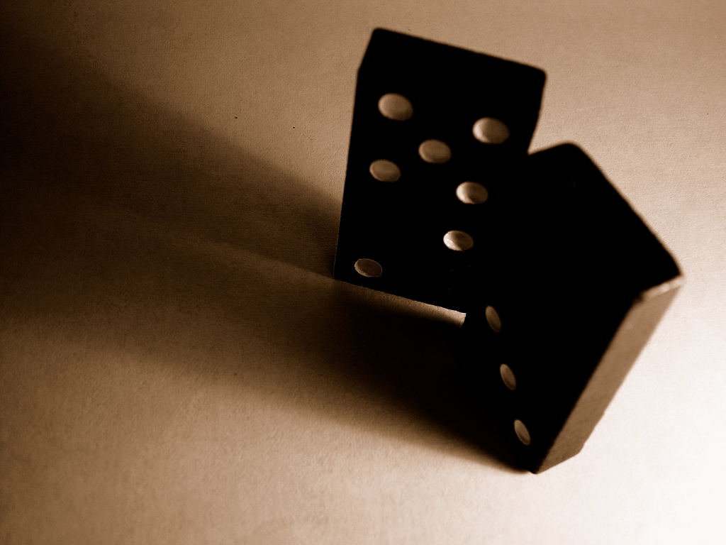 some black dices sitting in the middle of the table
