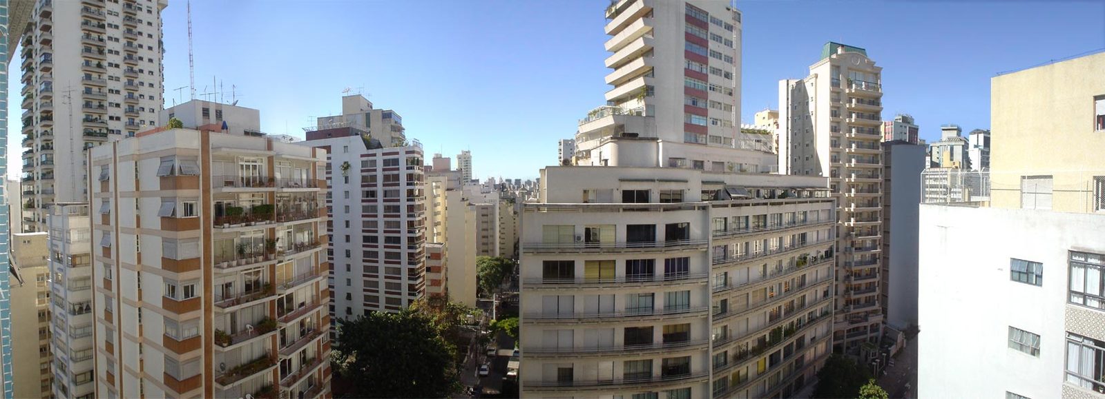 the windows on this building overlook the city and the street